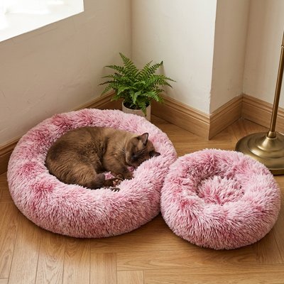 Coussin pour Chat Somnora™ offrant un espace cocooning sécurisant qui épouse la position naturelle de l'animal enroulé